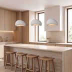 Three Wabi Sabi Fibreglass Resin Pendant Lights in white, Ø30 cm, in a row above a travertine kitchen island
