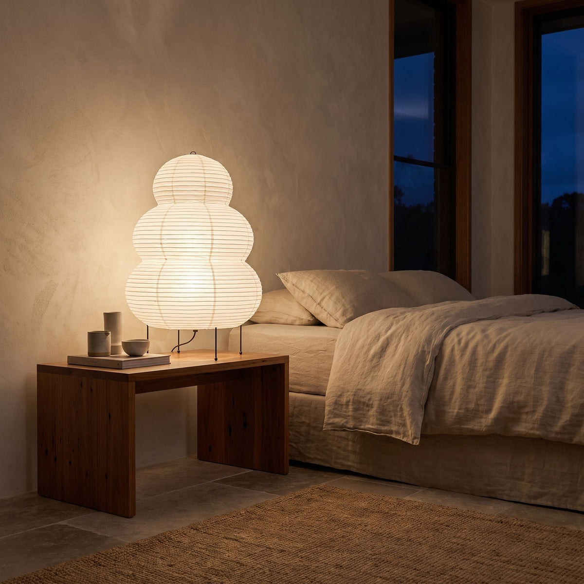 Wabi-Sabi Rice Paper Tripod Table Lamp on a bedside table