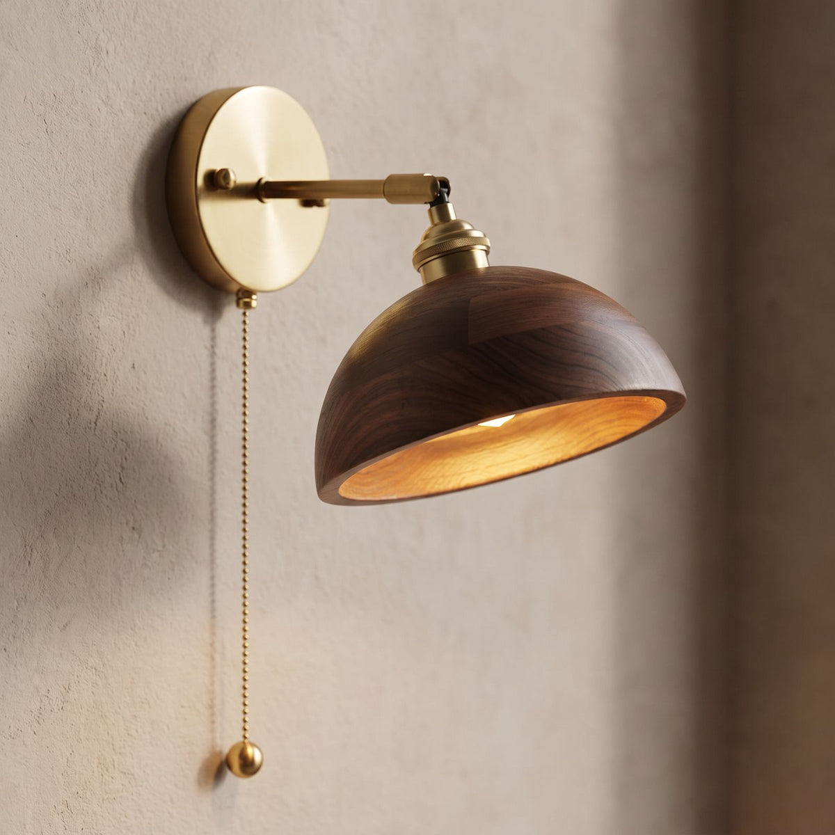 Walnut Dome Shade Pull Cord Wall Light, close view at 45 degrees on a plaster wall