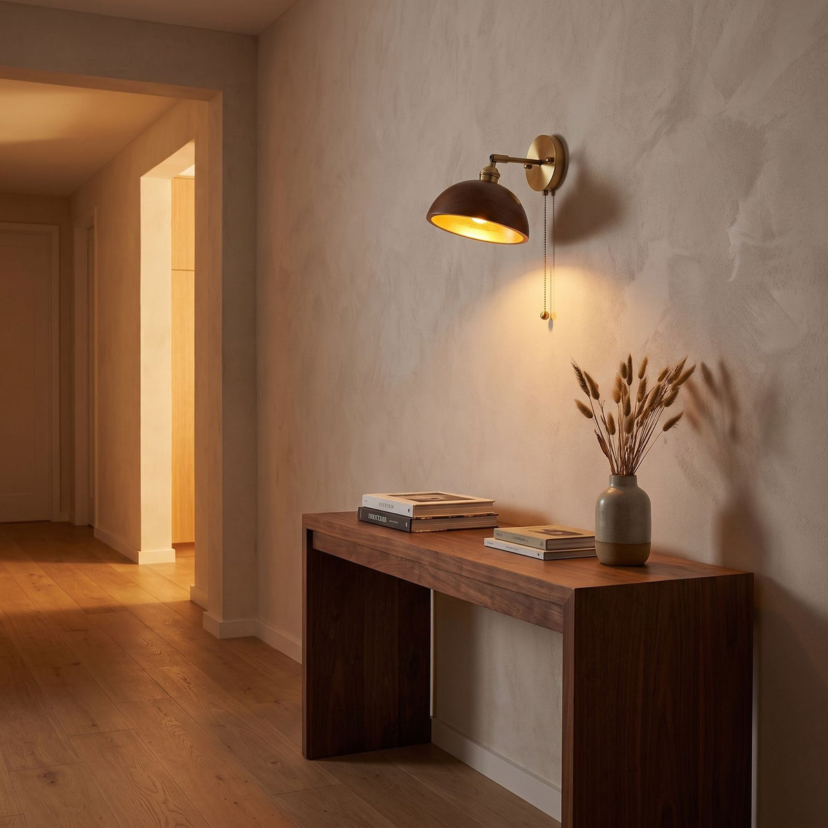 Walnut Dome Shade Pull Cord Wall Light in a hallway above a timber console