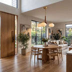 Walnut Wood and Brass Arm Glass Shade Chandelier in an open-plan living and dining room, wide view