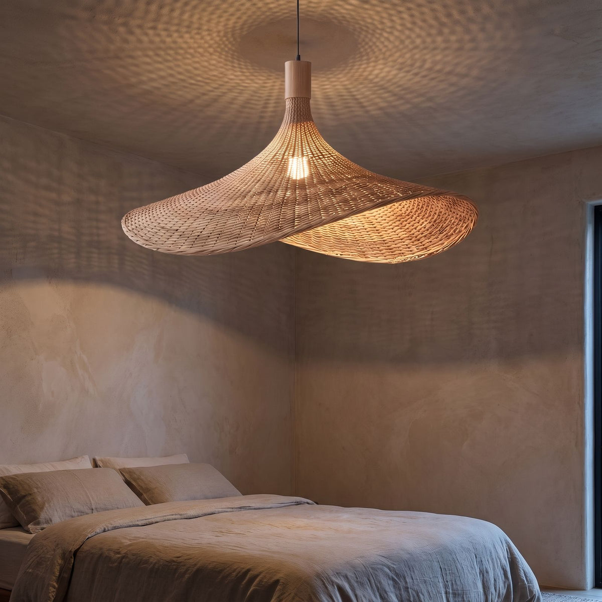 Wavy brim woven bamboo pendant light in a bedroom at night