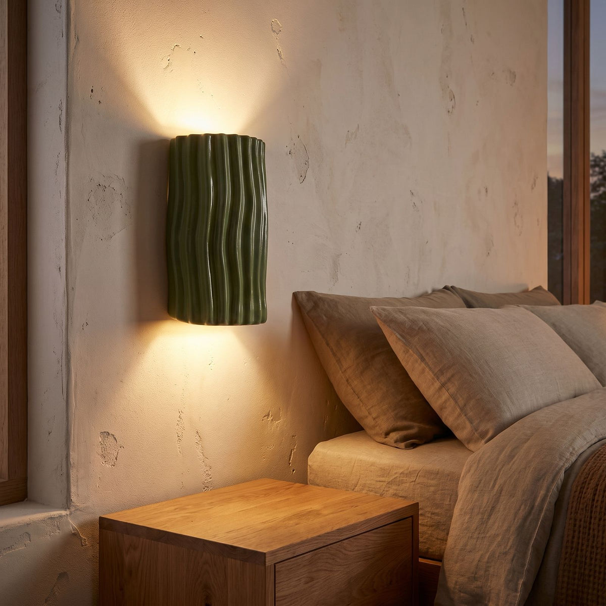 Wavy Ribbed Resin Half Cylinder Up Down Wall Light beside a bed