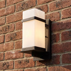 White Glass Black Iron Outdoor Wall Light, close view at 45 degrees on a stone wall