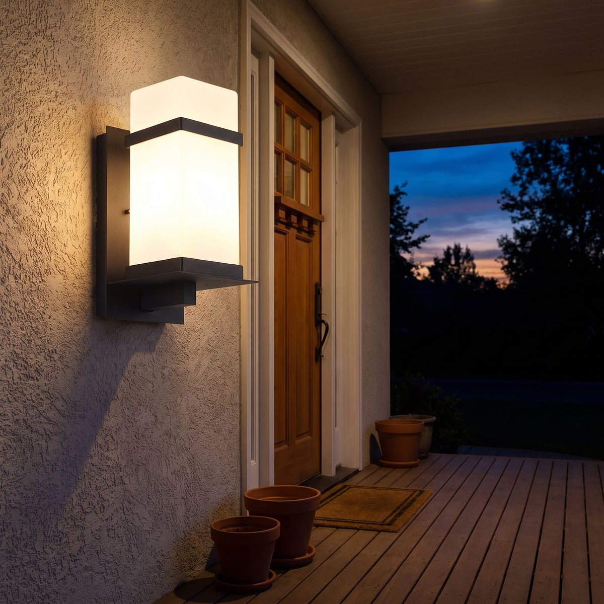 White Glass Black Iron Outdoor Wall Light on a porch wall at dusk