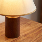 Wood Base Cone Shade Bedside Table Lamp, close view on a timber surface