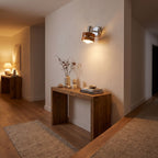 Wood Cylinder Shade Iron Disc Wall Light in a hallway above a timber console