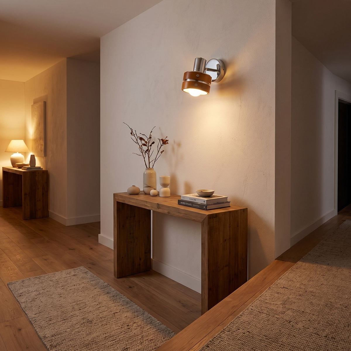 Wood Cylinder Shade Iron Disc Wall Light in a hallway above a timber console