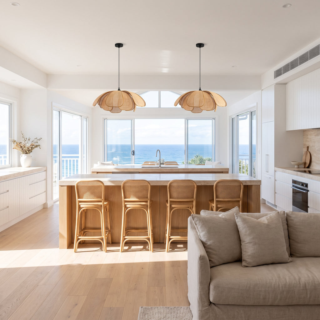 Two Woven Rattan Petal Flower Pendant Lights, Ø50 cm, above a kitchen island in a coastal beach house