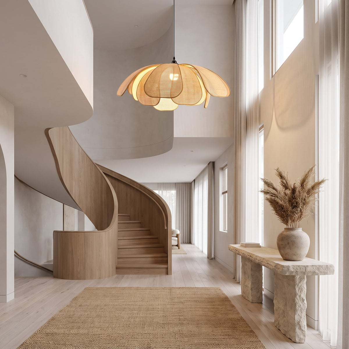 Woven Rattan Petal Flower Pendant Light, Ø80 cm, hanging in a double-height entry hallway with a curved staircase