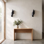 Wrap Around Aluminium and Glass Up Down Wall Light in a pair on a wall of an Australian home