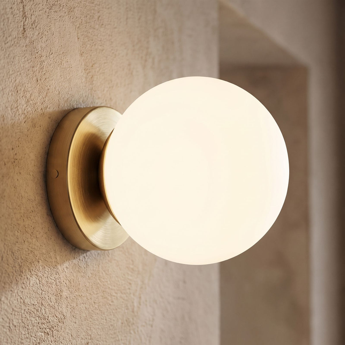 Wrought Iron Frame Glass Shade Wall Light, close view at 45 degrees on a plaster wall